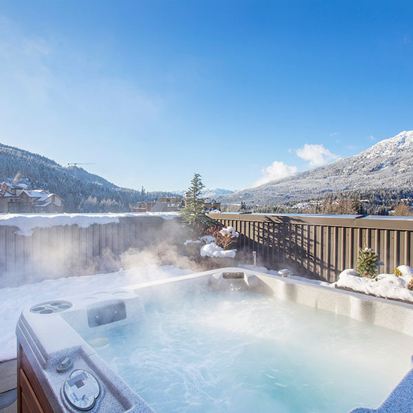 Hottub surrounded by Whistler mountains
