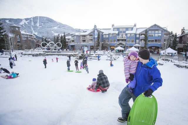 Families having fun at Olympic Plaza in Whistler BC